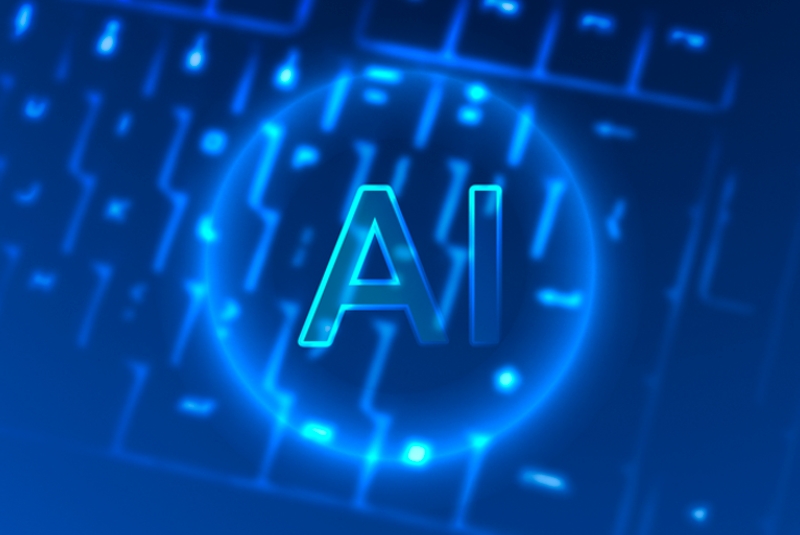 The word AI on a neon keyboard blue in color.